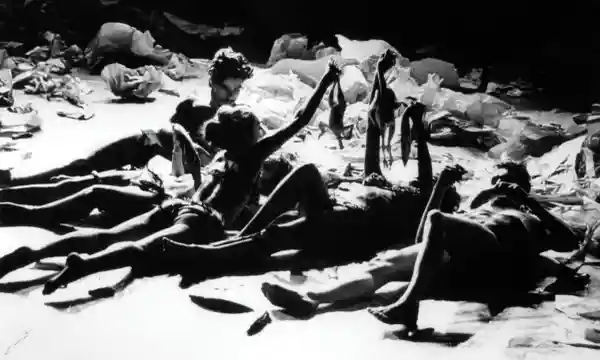 A group of people lying on the ground

Description automatically generated