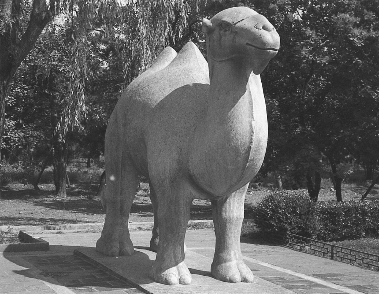 A photograph of a large stone statue of a camel.