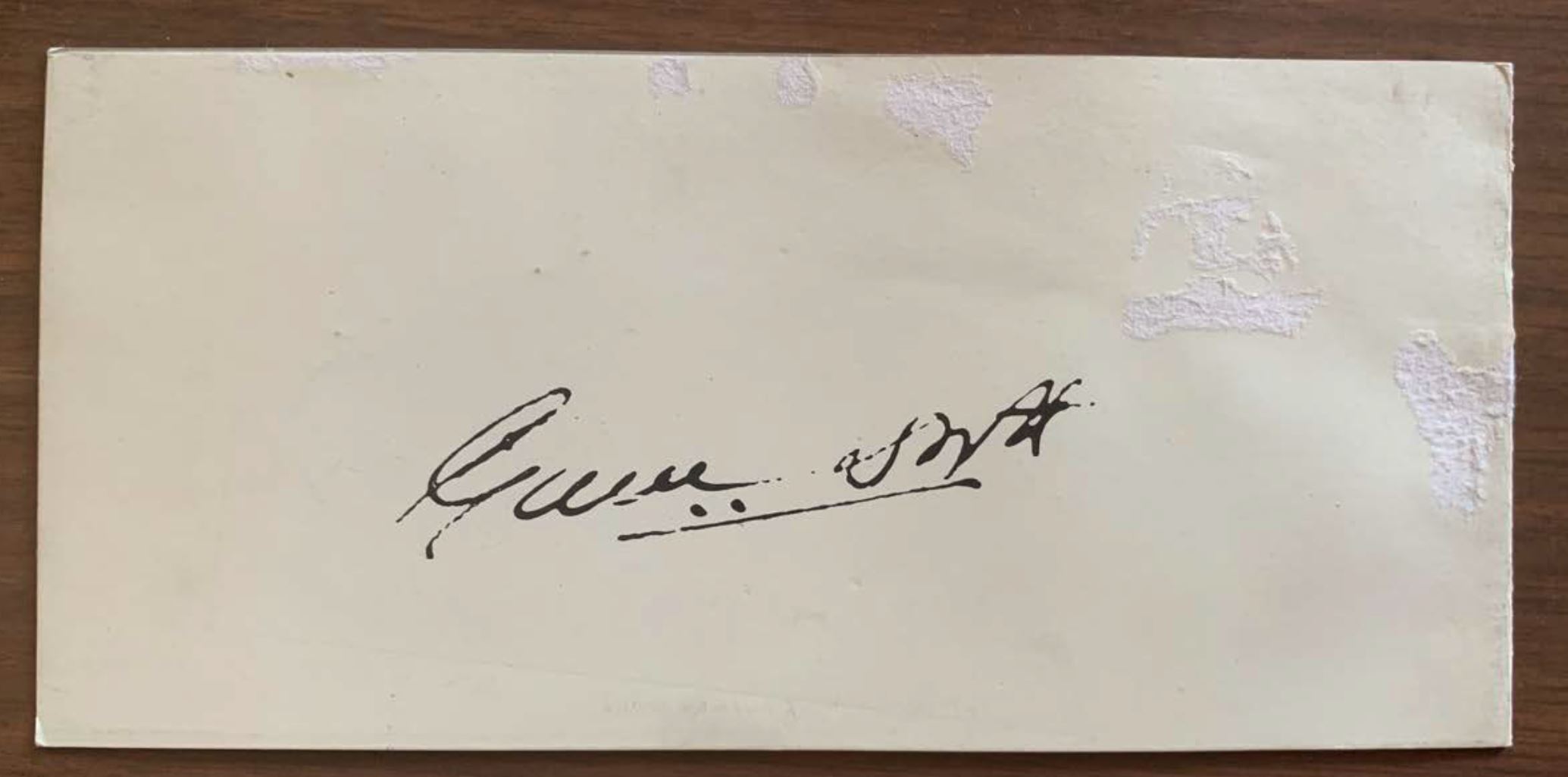 A piece of paper with a signature

AI-generated content may be incorrect.
