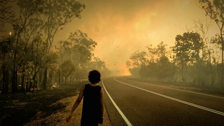 A person walking on a road

Description automatically generated
