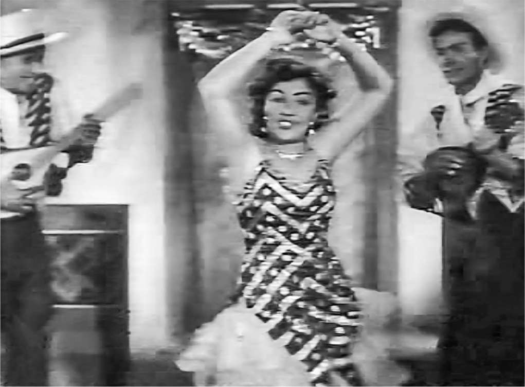 A young woman dressed in a glamorous, sleeveless Latin gown dances on stage with her arms above her head, accompanied by two musicians on either side playing string instruments.