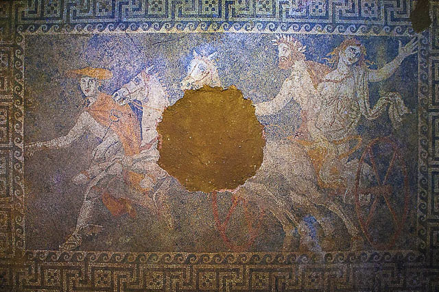 Hermes is on the far left leading the chariot aside, with Hades and Persephone astride a chariot pulled by two white horses. Hades holds onto persephone who is to the right of him in the chariot, and she is stretching a hand out to someone we do not see in the mosaic, likely her mother.