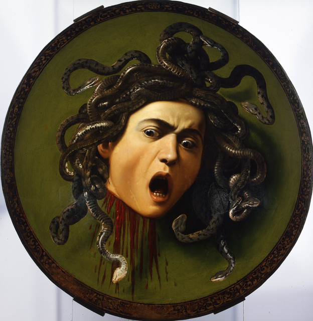 A dramatic painting by Caravaggio depicting the mythological figure Medusa. Medusa's intense gaze and serpentine hair create a sense of terror. The painting captures the moment of Medusa's transformation and freezes it in a hauntingly beautiful yet frightening image.