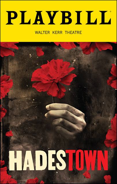 A playbill for the musical "Hadestown." At the top is yellow box that displays the words Playbill, with Walter Kerr Theatre in smaller words beneath. Underneath the box, the poster for Hadestown shows a ghostly hand holding a single red flower. Below the hand is the title "Hadestown." Around the border of the poster are red flower petals.
